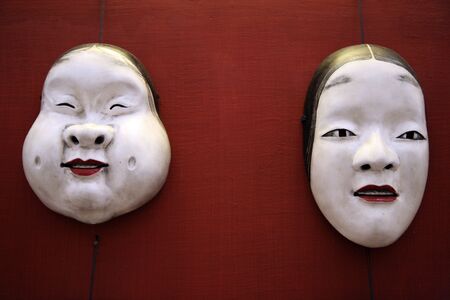 couples of oriental white masksの写真素材