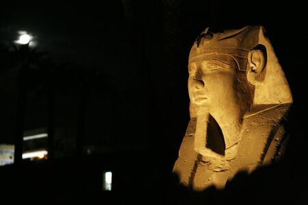 ramses sculpture and moon near luxor templeの写真素材
