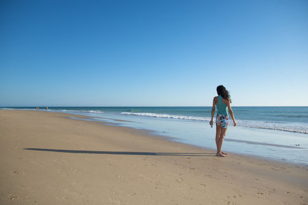 woman dressed at el palmar beach in cadiz spainの写真素材