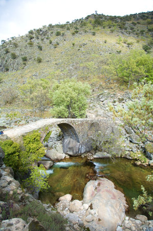old bridge at gredos mountains in avila spain