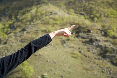 woman hand pointing with finger at right sideの写真素材