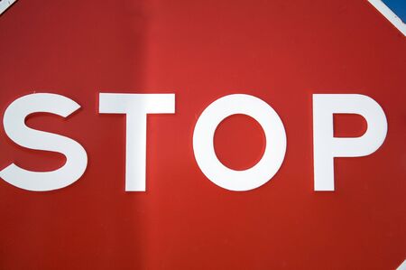 stop traffic sign next to road in valladolid spainの写真素材