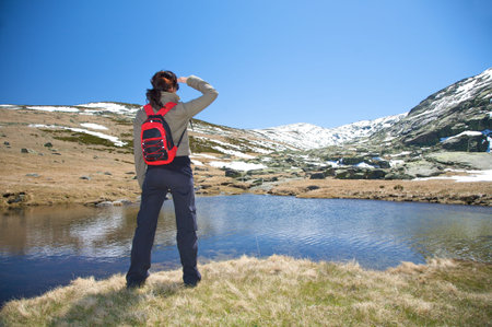 woman hiking at gredos mountains in avila spainの写真素材