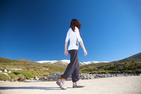 woman hiking at gredos mountains in avila spainの写真素材