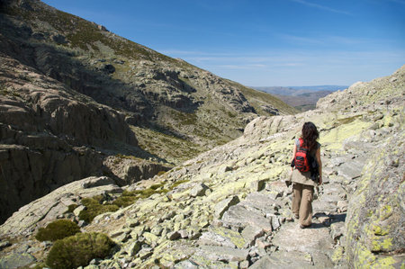 woman hiking at gredos mountains in avila spainの写真素材