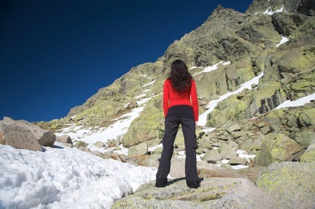 woman at the top of gredos mountains in avila spainの写真素材