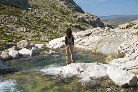 woman hiking at gredos mountains in avila spainの写真素材