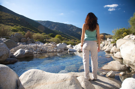 woman trekking at gredos mountains in avila spainの写真素材