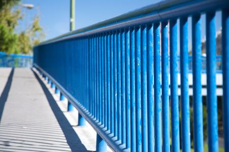footbridge with blue railing in madrid cityの写真素材
