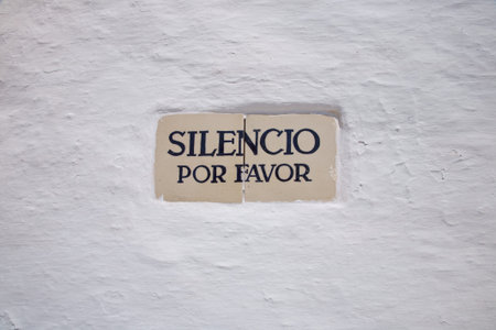 silence please advice on a white wall