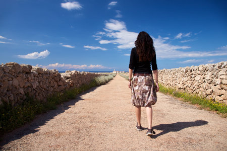 rural road towards Punta Nati Cape at Menorca island in Spainの写真素材