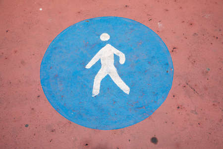pedestrian sign painted on the asphalt groundの写真素材