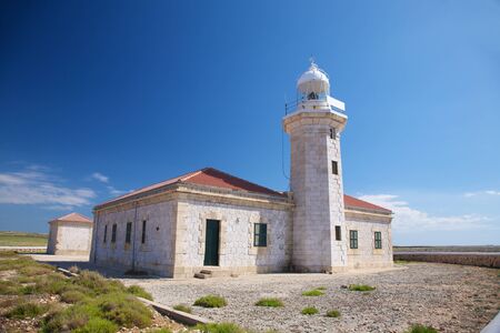 lighthouse of Punta Nati at Menorca island in Spainの写真素材