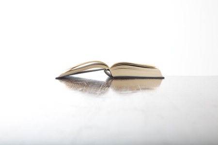 open book side on table and white backgroundの写真素材