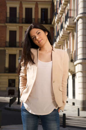 pretty brunette woman standing at street in Madrid city Spainの写真素材
