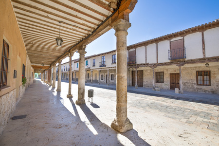 arcaded buildings, in medieval street, landmark and monument from seventeenth century, in Ampudia village, Palencia, Castile Leon, Spain, Europeのeditorial素材