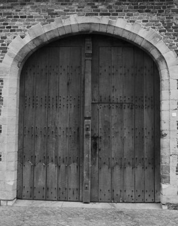A black and white study of an old gateway the village of Damme in Belgium.の写真素材