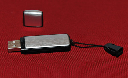 Silver USB memory aganst red