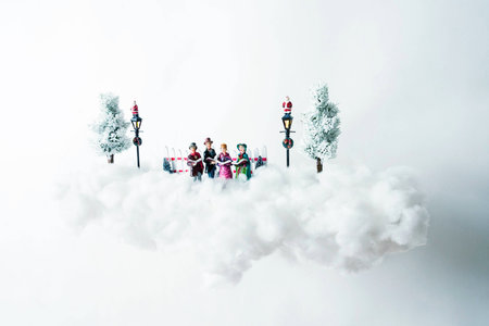 Christmas carolers floating on a cloud of cottonの写真素材