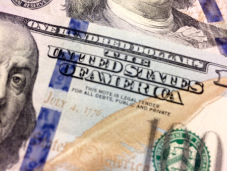 Anti counterfeit strip on american money with united states of america text
