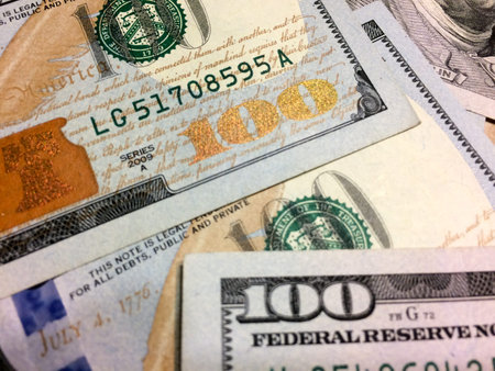 Gold number 100 on american cash currency dollar bill