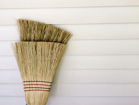 traditional broom background with white line of wallの写真素材