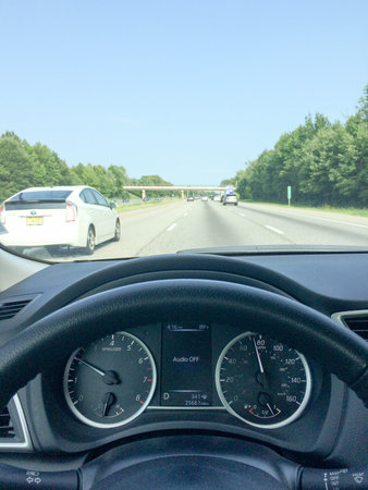 Higway driving on sunny day in car view outdoors
