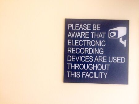 security cameras in use sign warning electronic devices are in useの写真素材