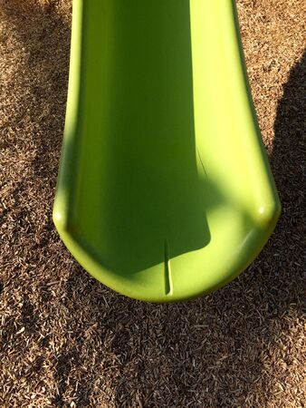 New modern recycled slide Playground equipment green plastic at park schoolの写真素材