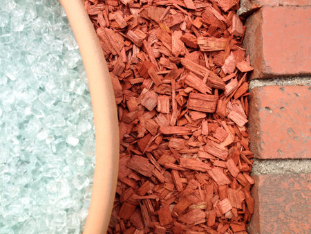 Smashed Broken glass decorative and red wood chips on groundの写真素材