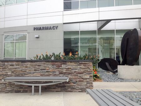 modern architecture business medical offices with flowers and modern art sculpture outdoorsの写真素材