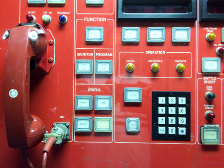Emergency use only red phone hotline call button switch concept on USS Iowa naval warship destroyer...