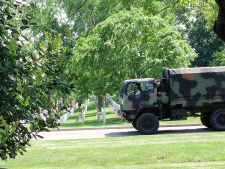 US Army soldiers planting American flags at Arlington National cemetaryのeditorial素材