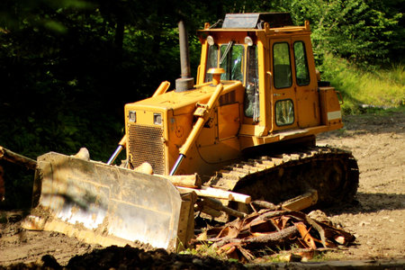 Yellow bulldozer in forest