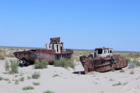 Destruction of the ships - The picture is made in Kara-Kalpak  Uzbekistan  in the dead city of Mujnak  On the given place 15 years ago there was Aral sea Destruction of the ship - The picture is made in Kara-Kalpak  Uzbekistan  in the dead city of Mujnakのeditorial素材
