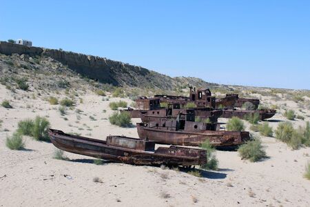 Destruction of the ships - The picture is made in Kara-Kalpak  Uzbekistan  in the dead city of Mujnak  On the given place 15 years ago there was Aral sea Destruction of the ship - The picture is made in Kara-Kalpak  Uzbekistan  in the dead city of Mujnakのeditorial素材