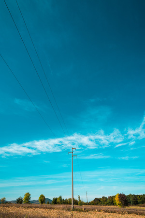 Countryside landscape with electrical post verticalの写真素材