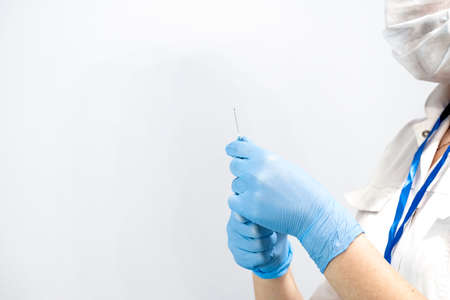 preparing an injection of a vaccine against coronavirusの写真素材