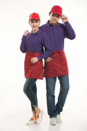 Asian waiter and waitress standing in white backgroundの写真素材
