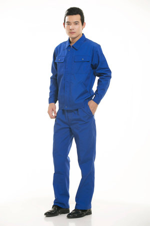 The young engineer various occupation clothing standing on white backgroundの写真素材