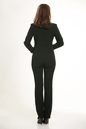 Young Asian women wearing a suit in front of a white backgroundの写真素材