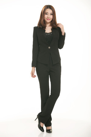 Young Asian women wearing a suit in front of a white backgroundの写真素材