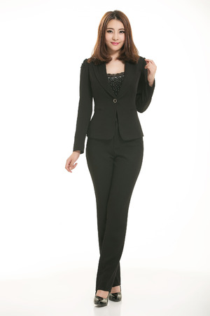 Young Asian women wearing a suit in front of a white backgroundの写真素材