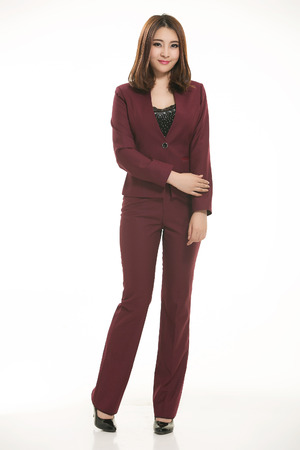Young Asian women wearing a suit in front of a white backgroundの写真素材