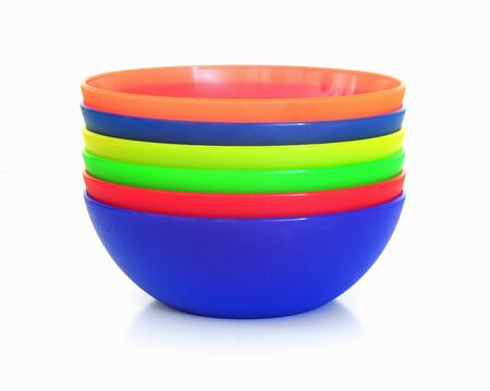 Colorful plastic dessert bowls isolated on white backgroundの写真素材