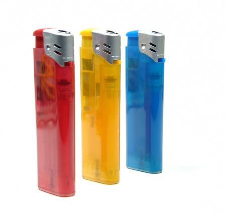 Three colorful lighters over white backgroundの写真素材