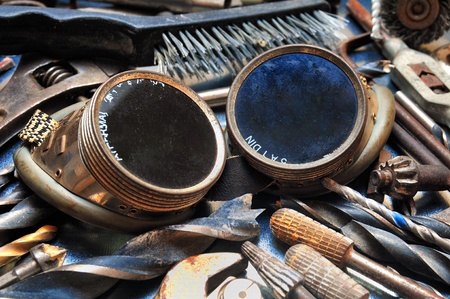 Welding goggles between used industrial toolsの写真素材