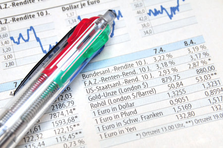 Ball point on top of a stock market report