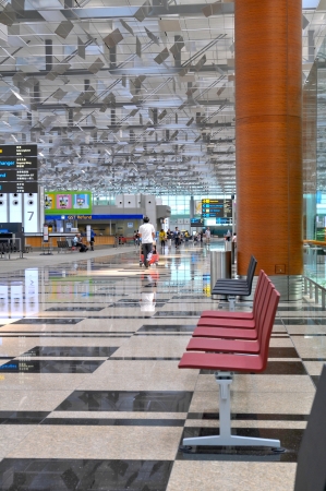 Airport scene of Terminal 3 of Changi Airport in Singapore - Travellers relaxing and waiting for check-in のeditorial素材