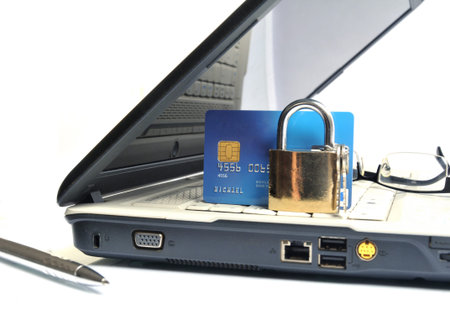 Laptop with credit card and padlock